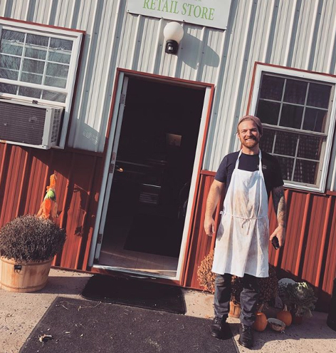 Butcher, Doug Palmer in front of SFM store