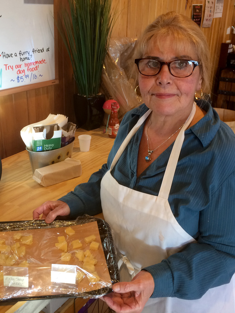 Denise serving cheese samples at Skillman Farm Market and Butcher Shop