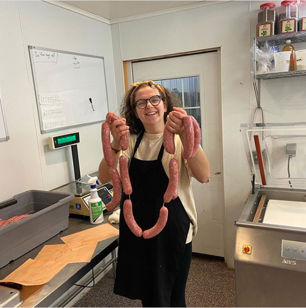 Julia helps our head Butcher, Doug, make sausages