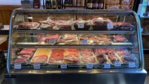 meat display case stocked for 4th of July